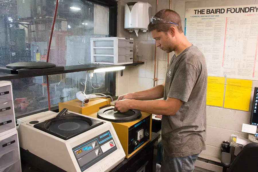 a worker fixing a machine